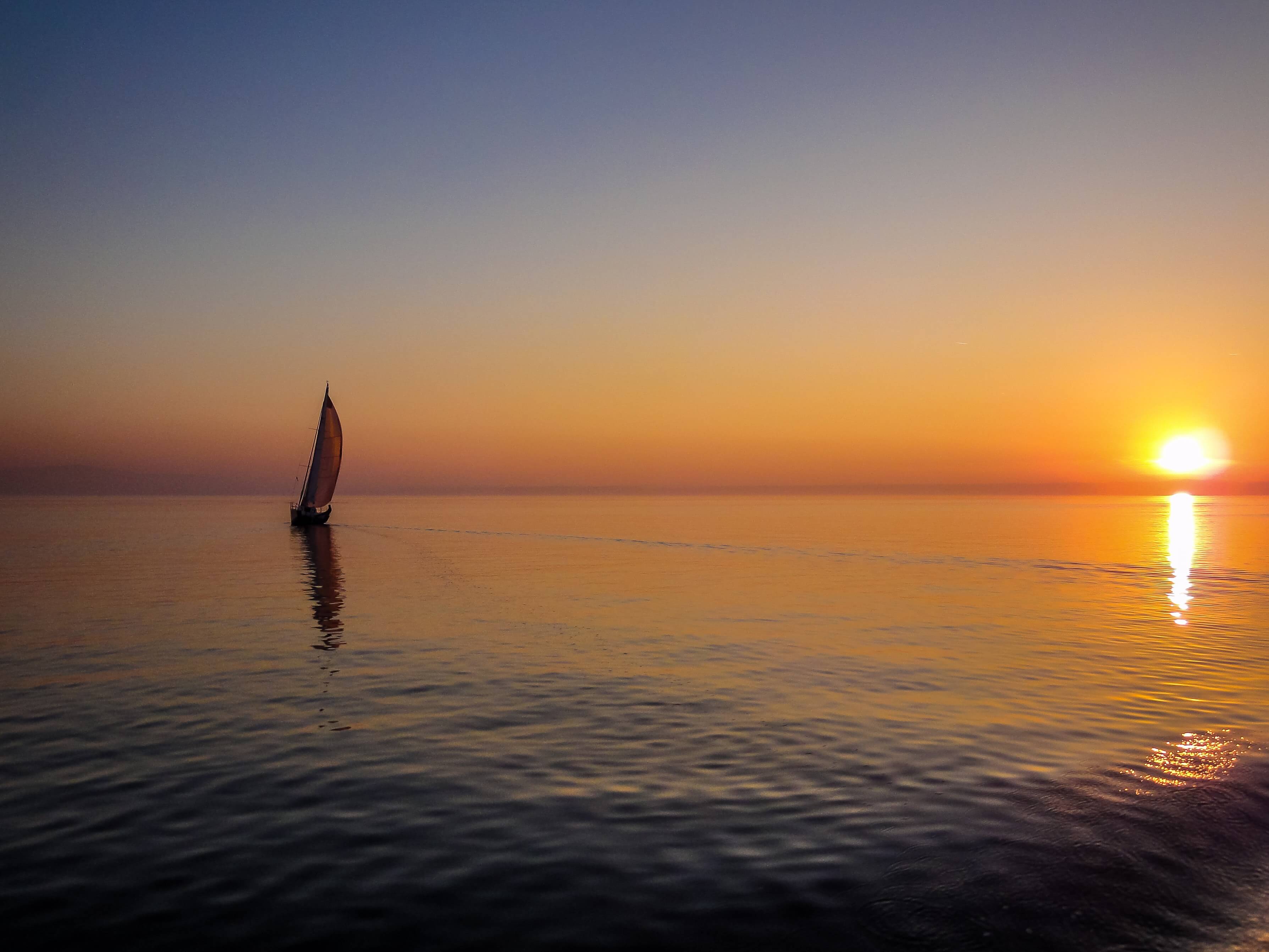 sailing boat on the sea at sunset