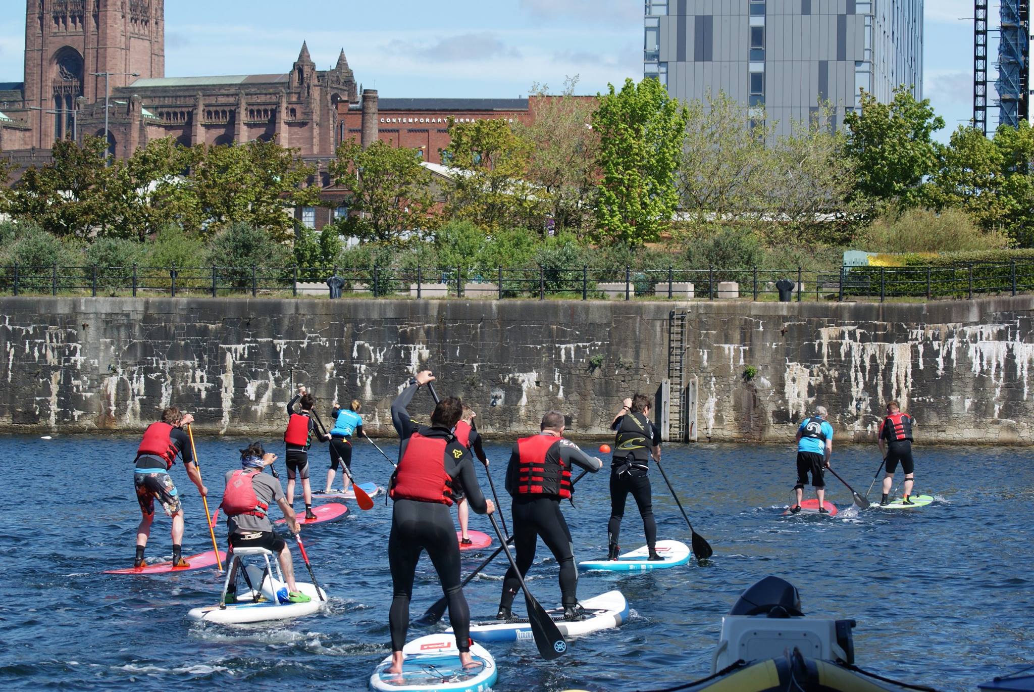 Group Paddleboarding In Liverpool Dock