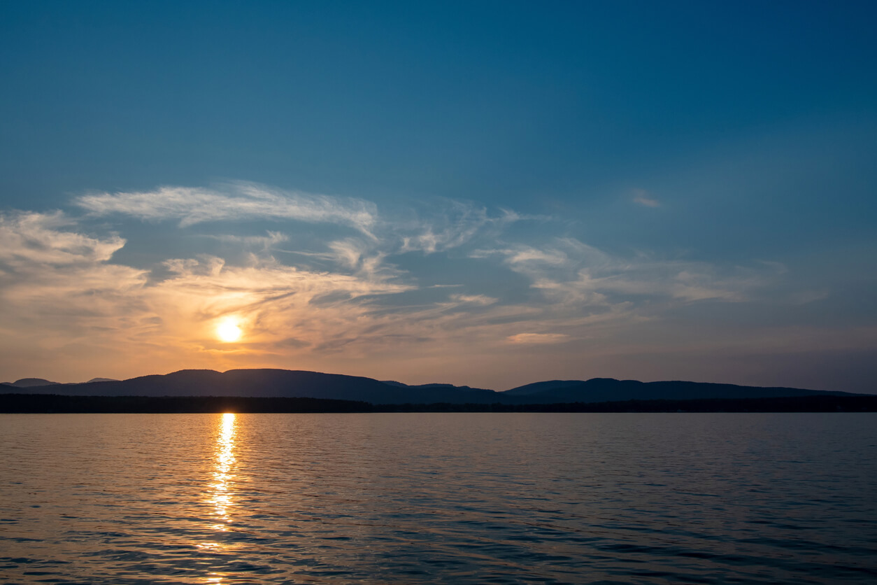 Sunset on the Lake Champlain with Adirondack mountains
