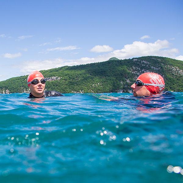 A Man and Woman swimming in Lake Annecy