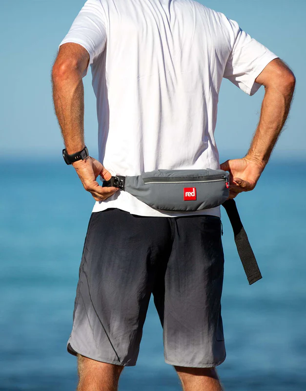 Man wearing Red Original personal floatation device in grey