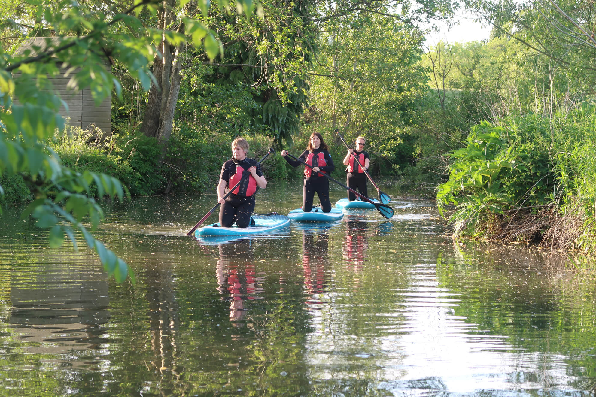 3 Paddle Boarders on the River Leam