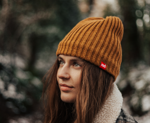 woman wearing ribbed beanie hat in mustard