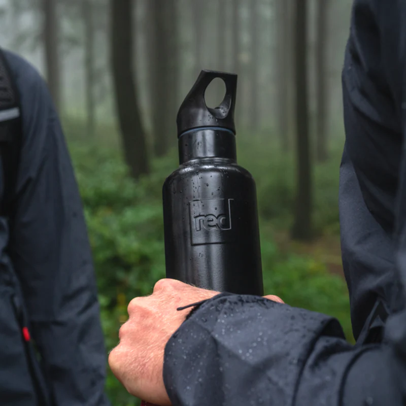 Person holding Red Original insulated water bottle in black