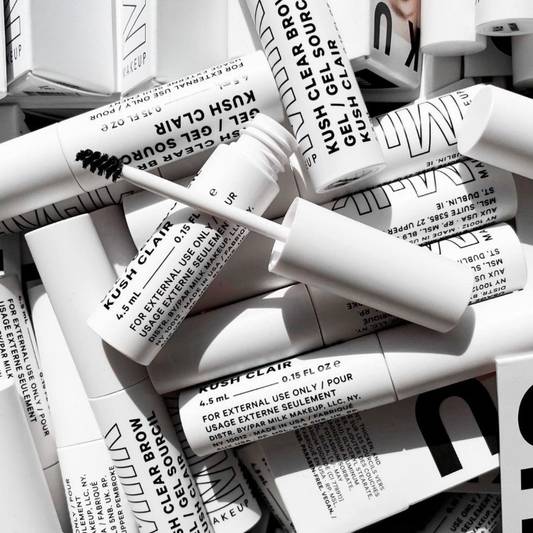 Stacked tubes of Milk Makeup KUSH Clear Brow Gel for fluffy brows