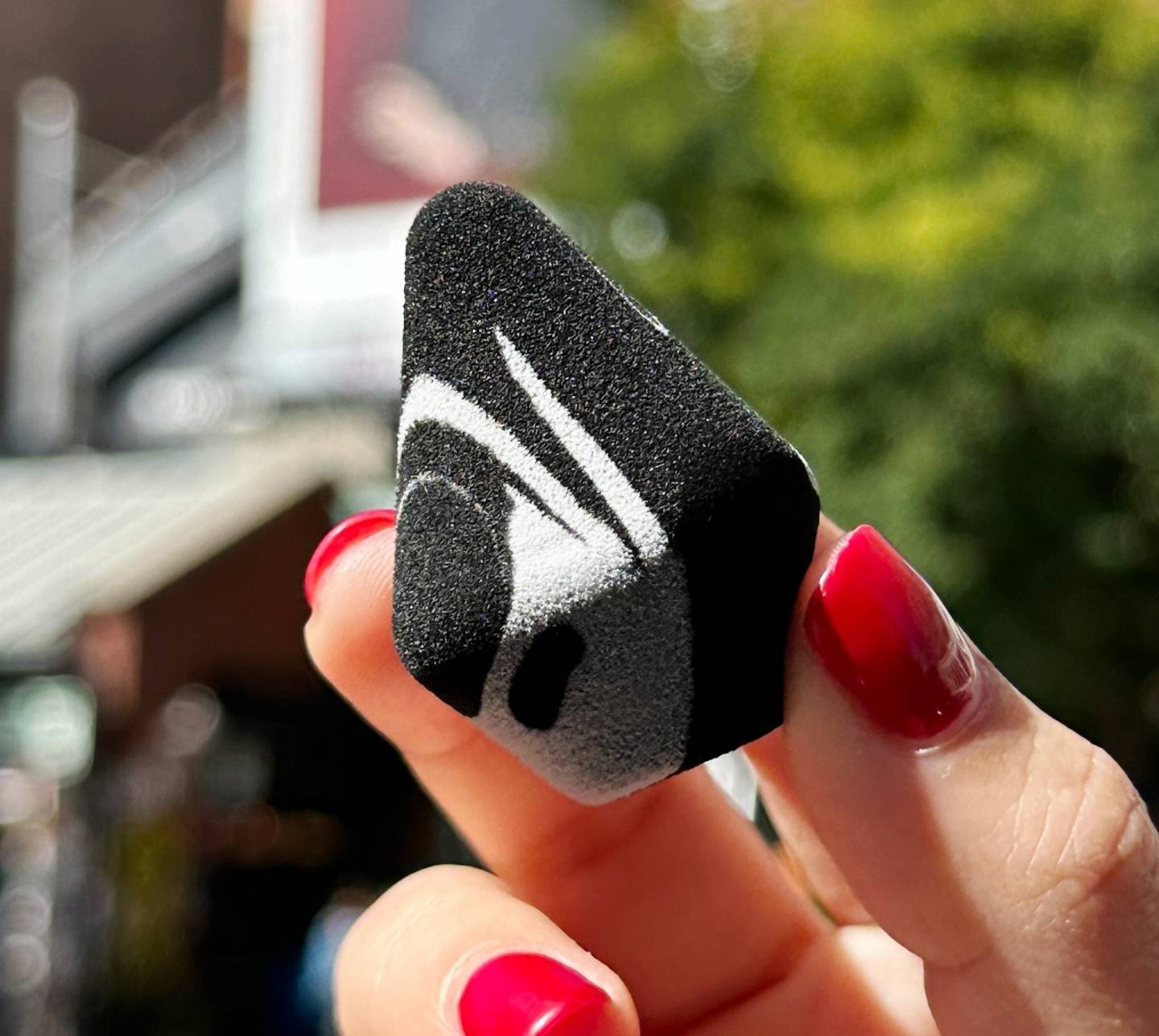 Hand holding Milk Makeup Prism Sponge