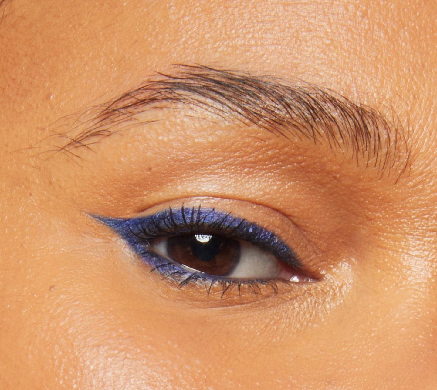 Close-up of model's eye wearing Milk Makeup Infinity Long Wear Eyeliner in Time