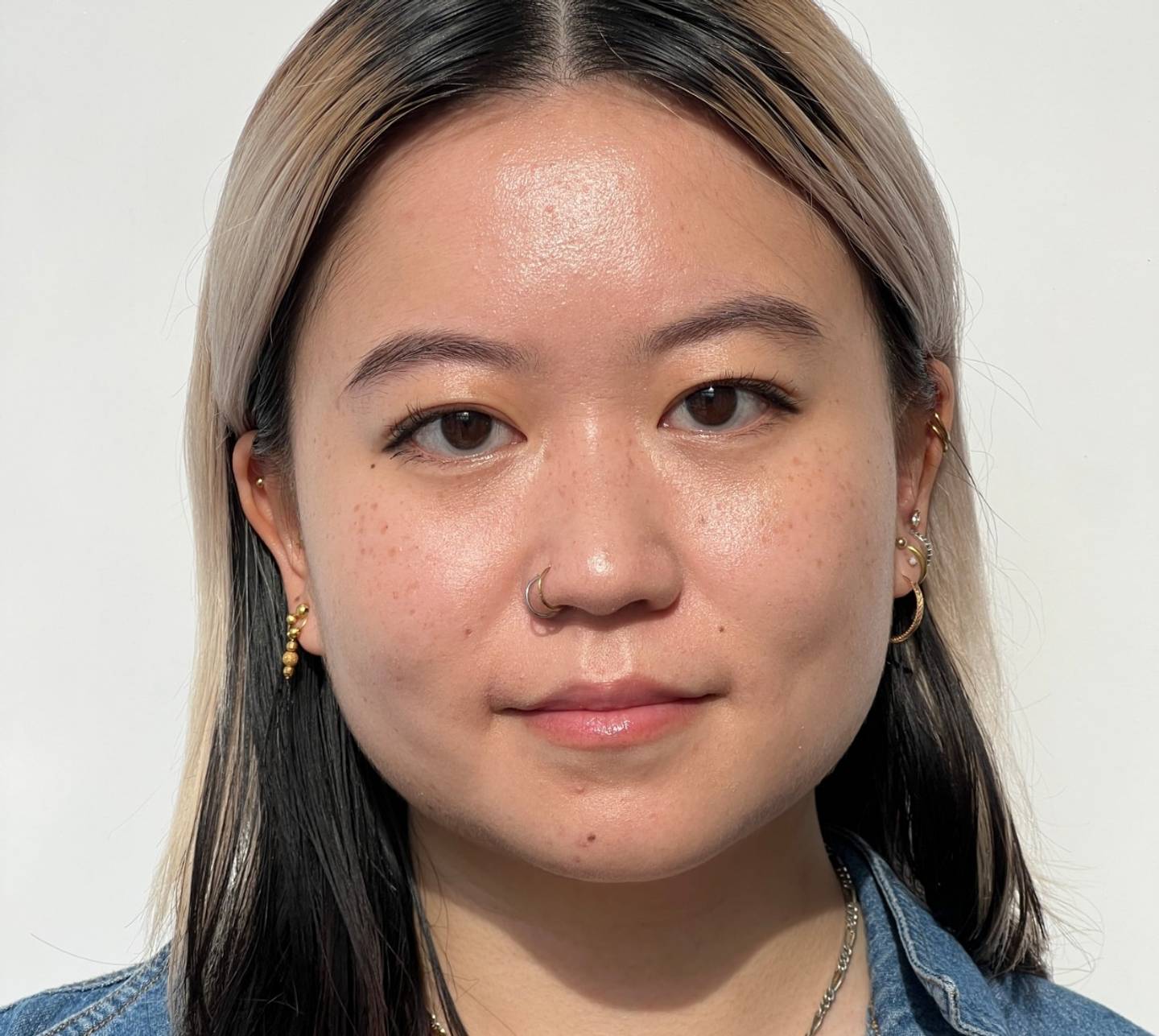 Portrait of a model wearing puppy eyeliner makeup on a white background