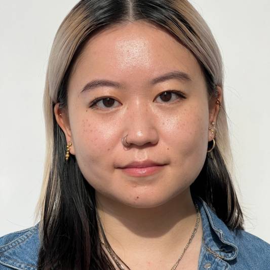 Portrait of a model wearing puppy eyeliner makeup on a white background