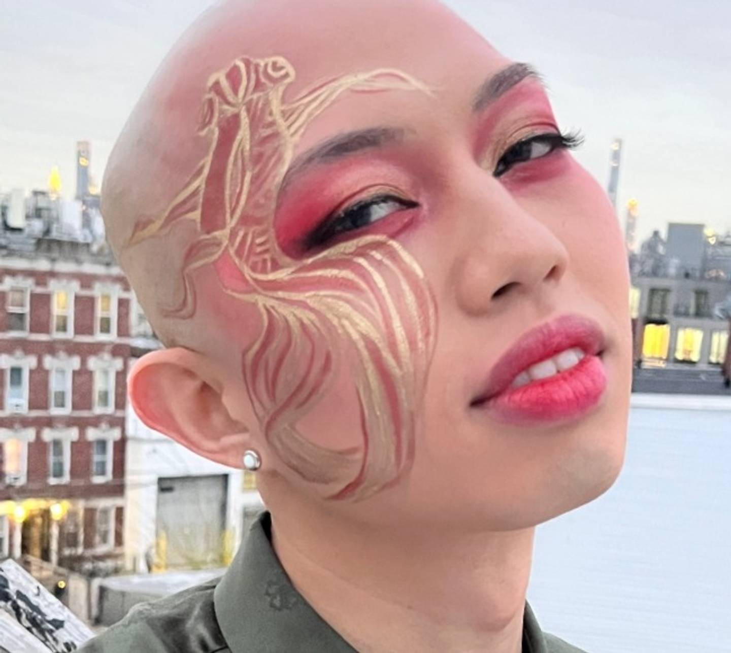 Johnathan Nguyen wears a goldfish-inspired makeup look to celebrate the Lunar New Year