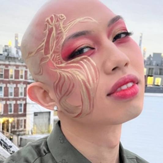 Johnathan Nguyen wears a goldfish-inspired makeup look to celebrate the Lunar New Year
