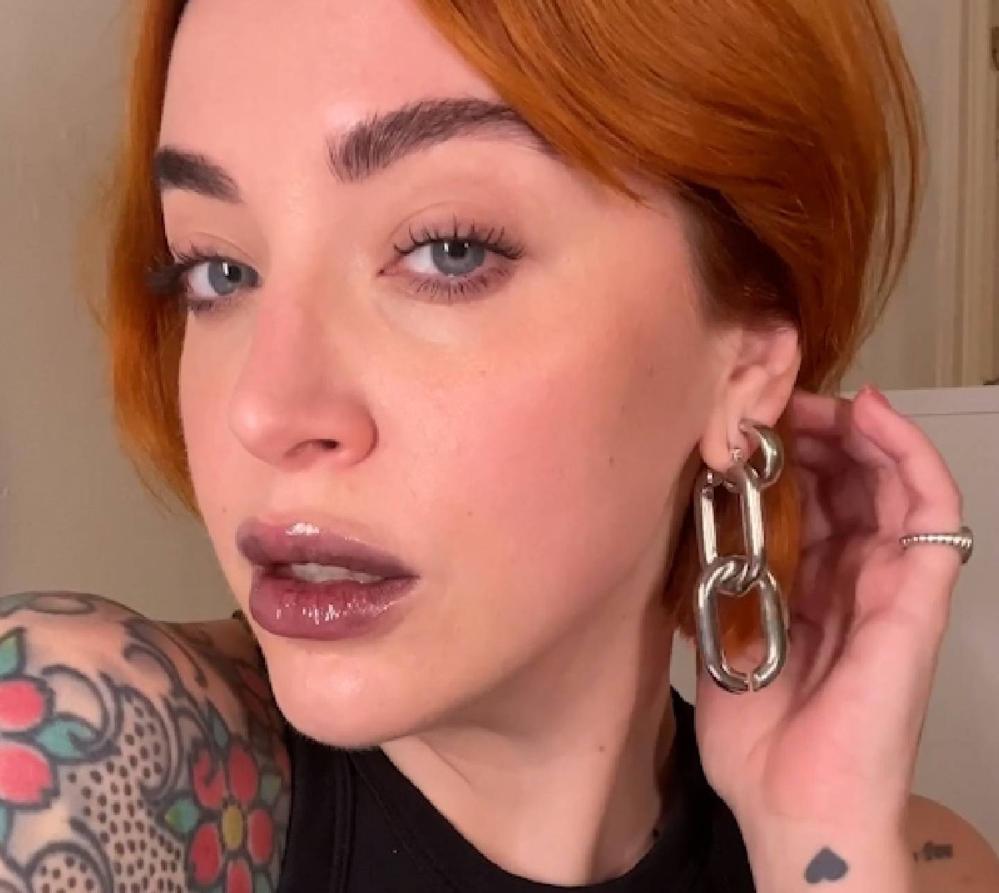 Milk Makeup Director of Artistry Sara Wren wears a sheer black lip gloss look.