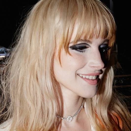 Paramore lead singer Hayley Williams wearing Milk Makeup on 2023 tour