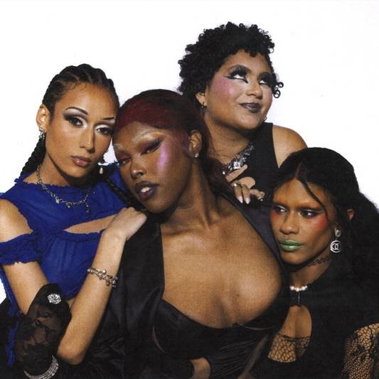 Haus of Telfar members Niala, Symone, Arie, and Iris posed together against a white background.