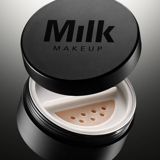 Product shot of Milk Makeup Pore Eclipse Matte  Translucent Setting Powder on a gradient gray-to-black background