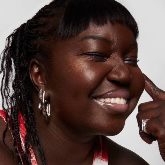 Model wears Milk Makeup Infinity Long Wear Eyeliner in Limitless as a lip liner on a white background