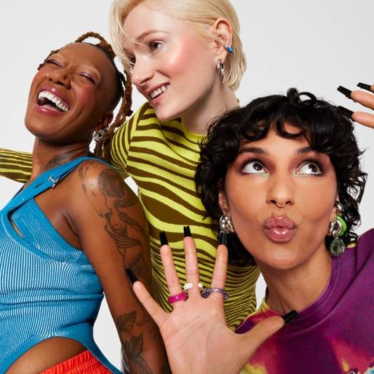 Models wear Milk Makeup products in a colorful holiday campaign