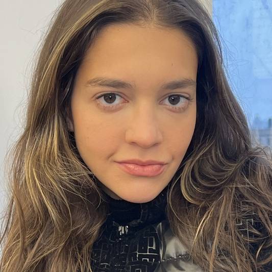 Photo of Milk Makeup Intern Ella Torres against a background of New York City