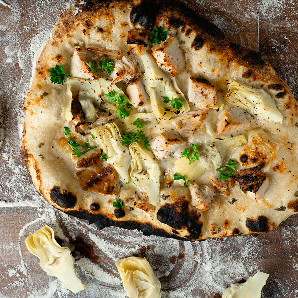 Lemon & herb ricotta chicken artichoke pizza made with Sonoma Gourmet's lemon herb ricotta