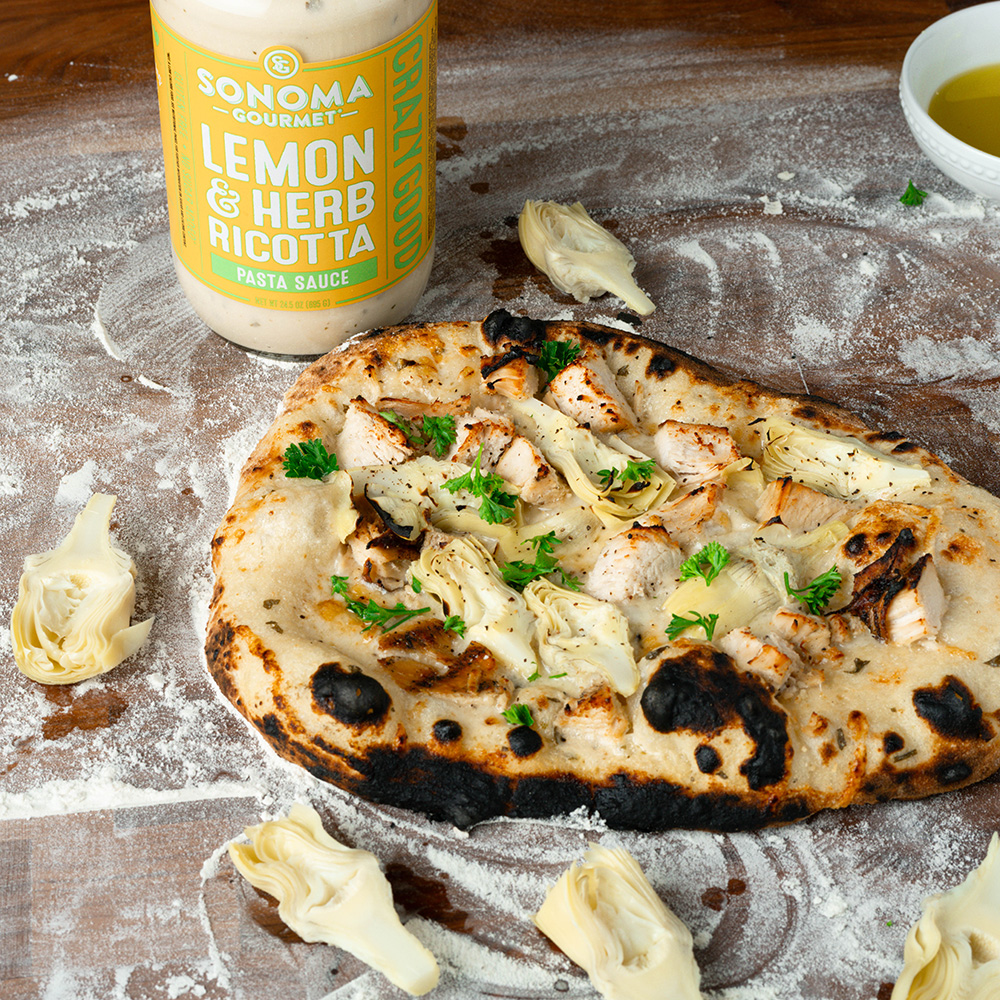 Lemon & herb ricotta chicken artichoke pizza made with Sonoma Gourmet's lemon herb ricotta