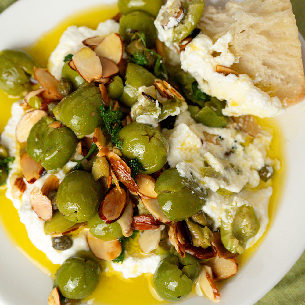 Sautéed garlic ricotta w/ crushed olives, almonds & lemon made with Sonoma Gourmet's sauteed garlic olive oil