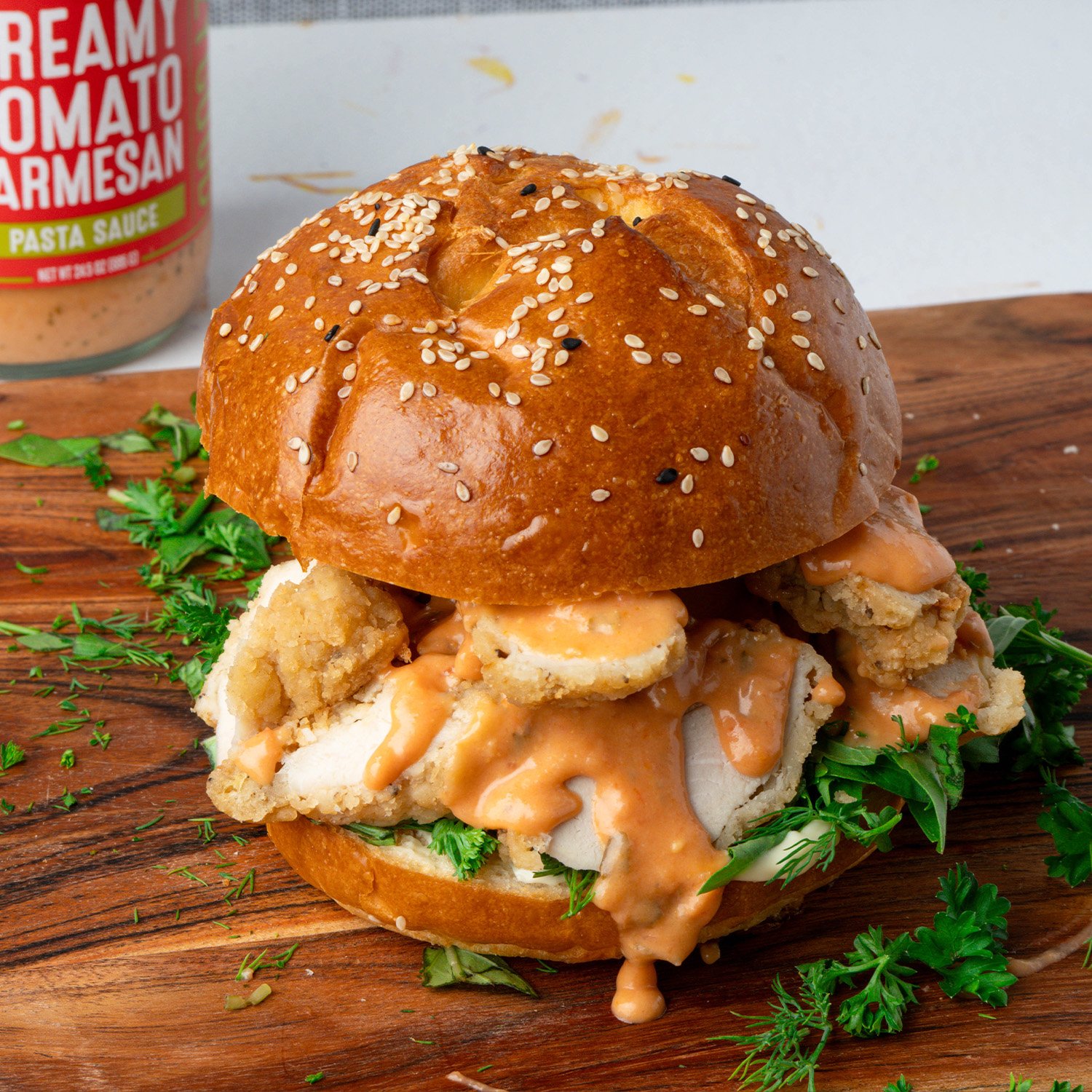 5-minute tomato parm fried chicken sando made with Sonoma Gourmet's creamy tomato parmesan