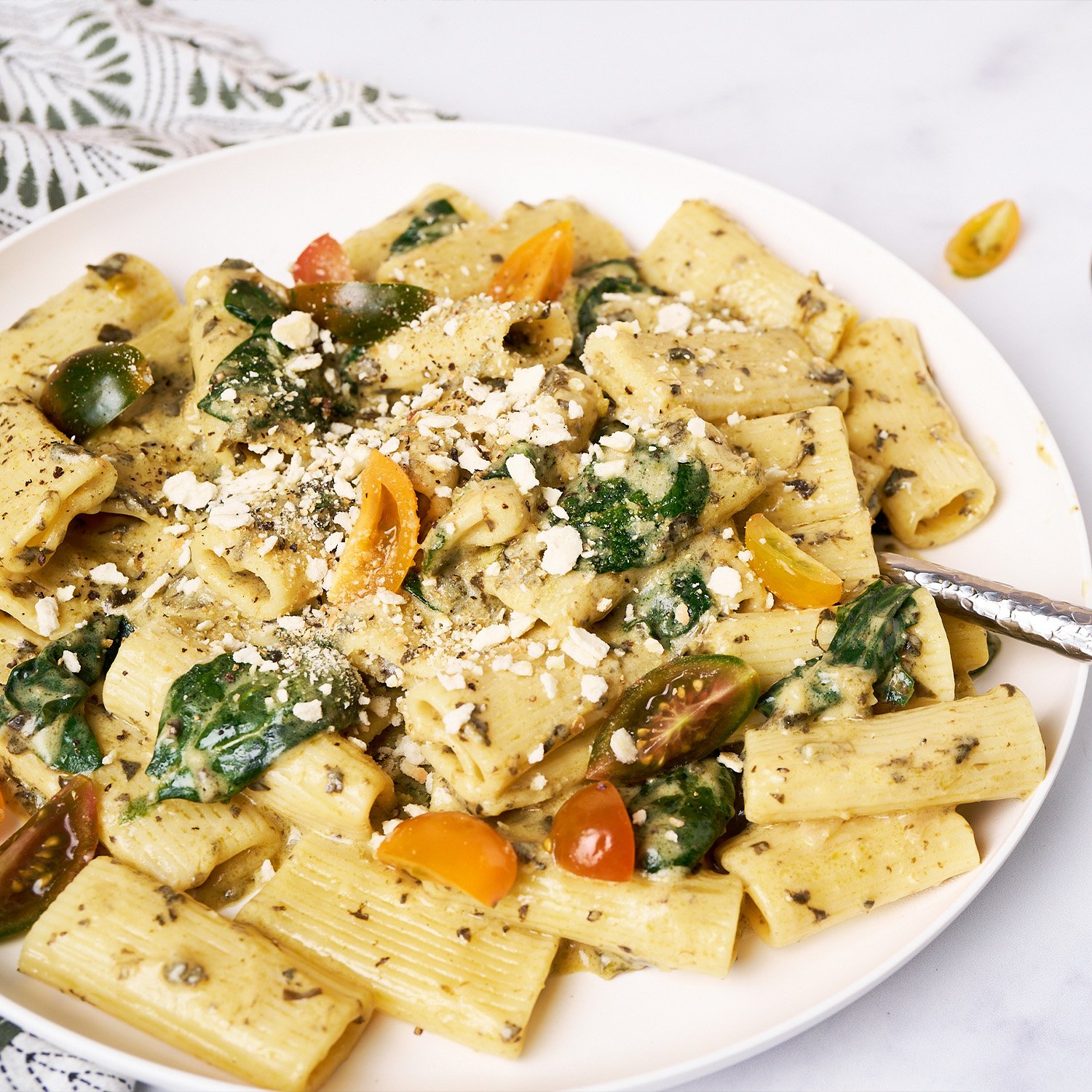 Creamy spinach alfredo rigatone made with Sonoma Gourmet's spinach alfredo sauce