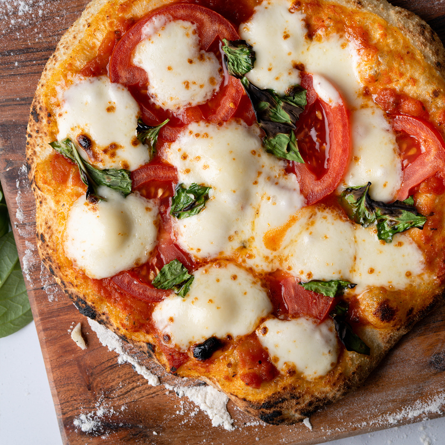Personal marg pizza made with Sonoma Gourmet's heirloom tomato pizza sauce
