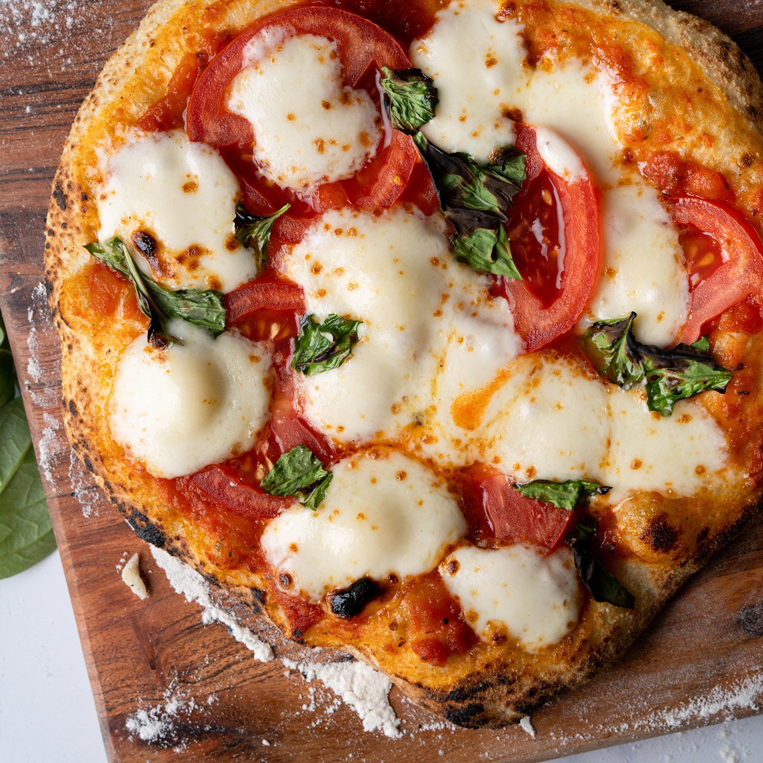 Personal marg pizza made with Sonoma Gourmet's heirloom tomato pizza sauce