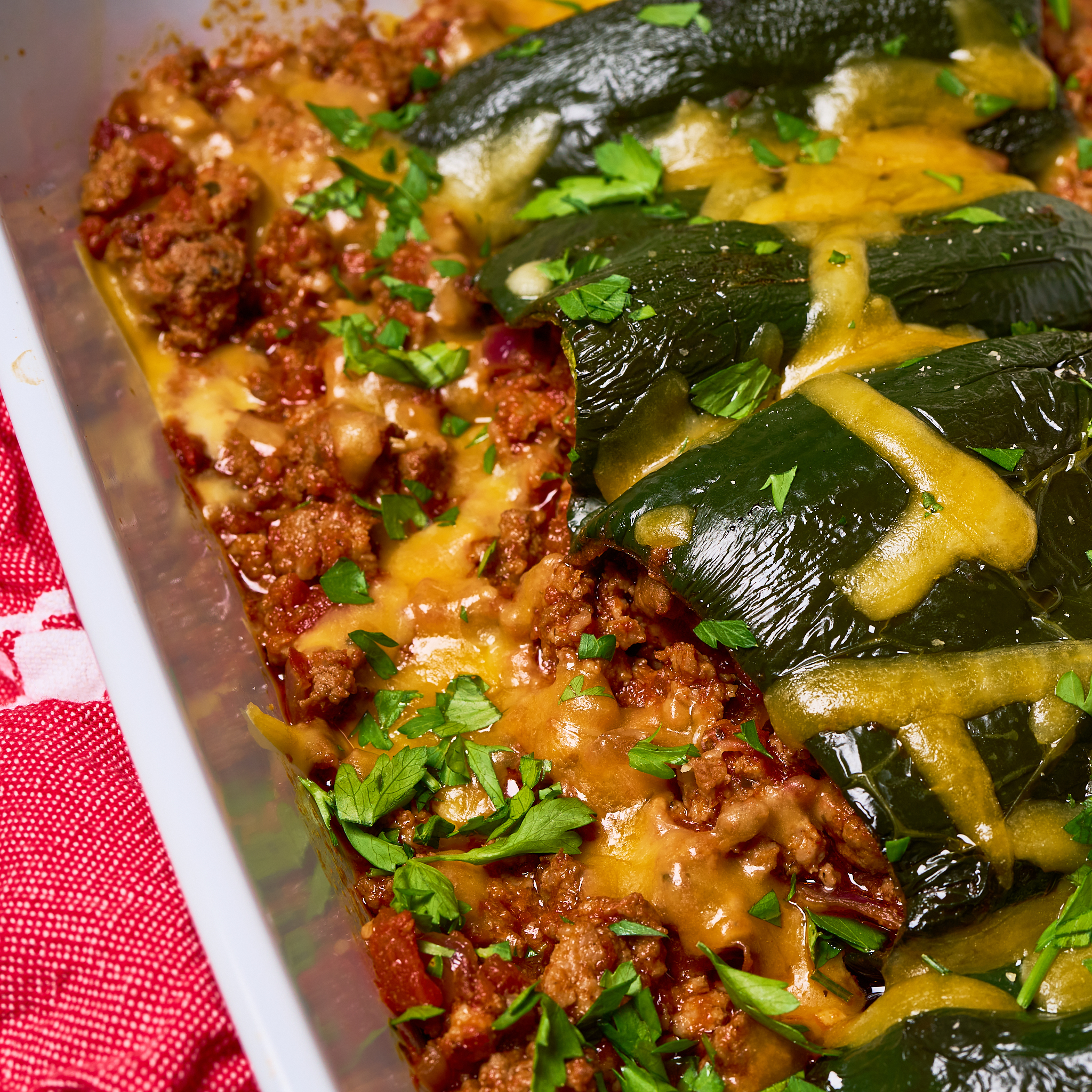 Stuffed saucy poblano peppers made with Sonoma Gourmet's cherry tomato basil sauce