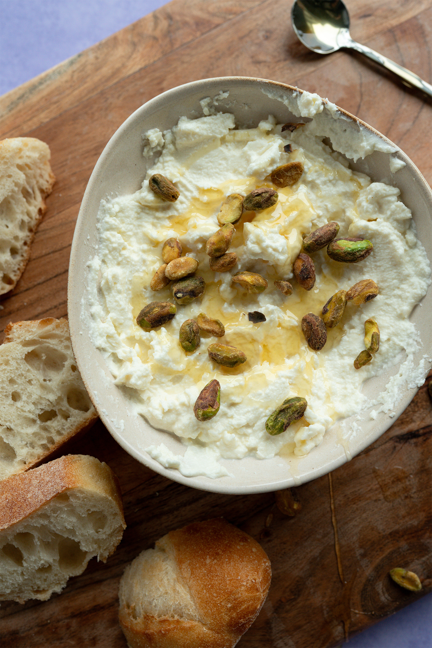 Whipped feta with honey & pistachios made with Sonoma Gourmet's garlic herbs olive oil
