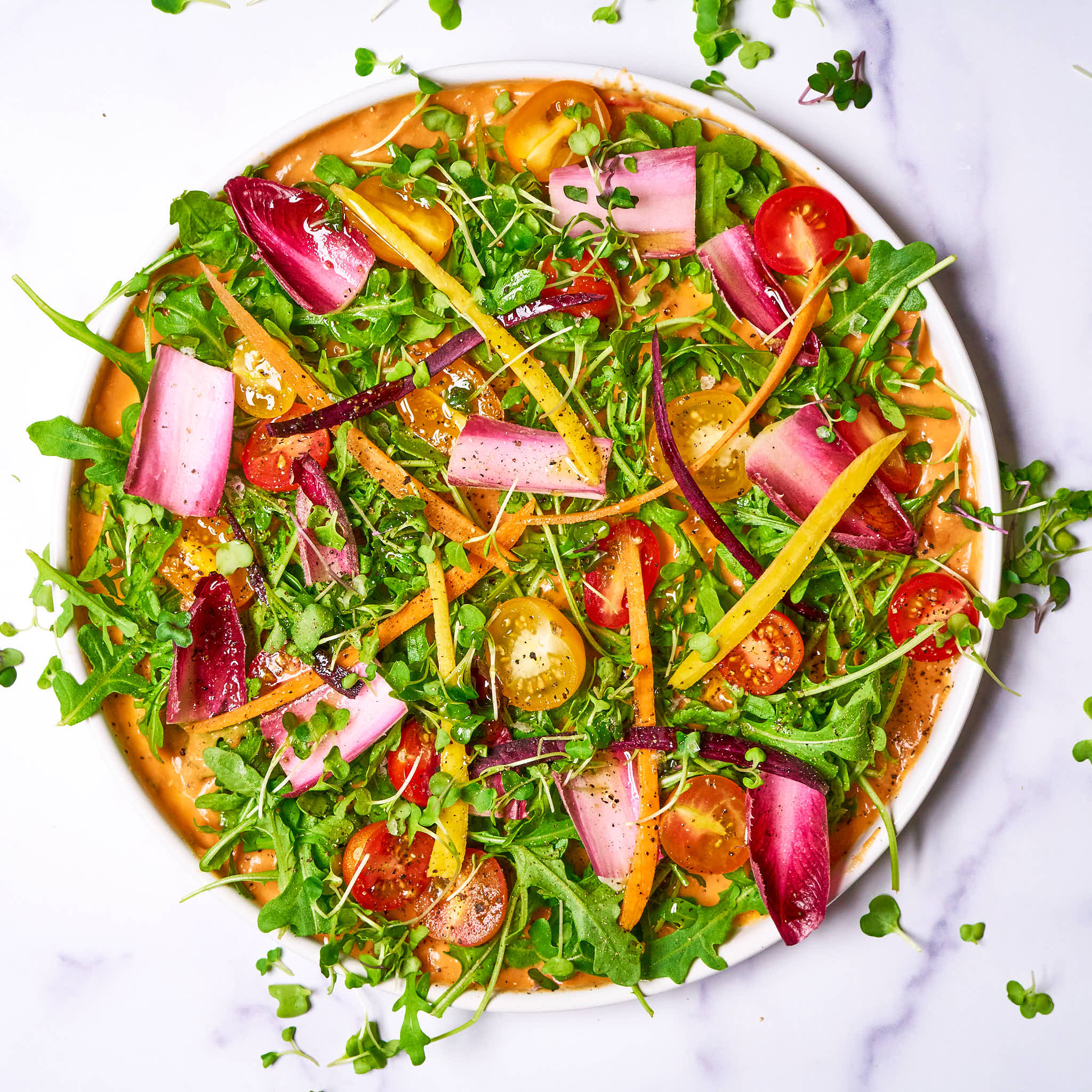 Saucy salad made with Sonoma Gourmet's creamy tomato parmesan and proof 100 california extra virgin olive oil