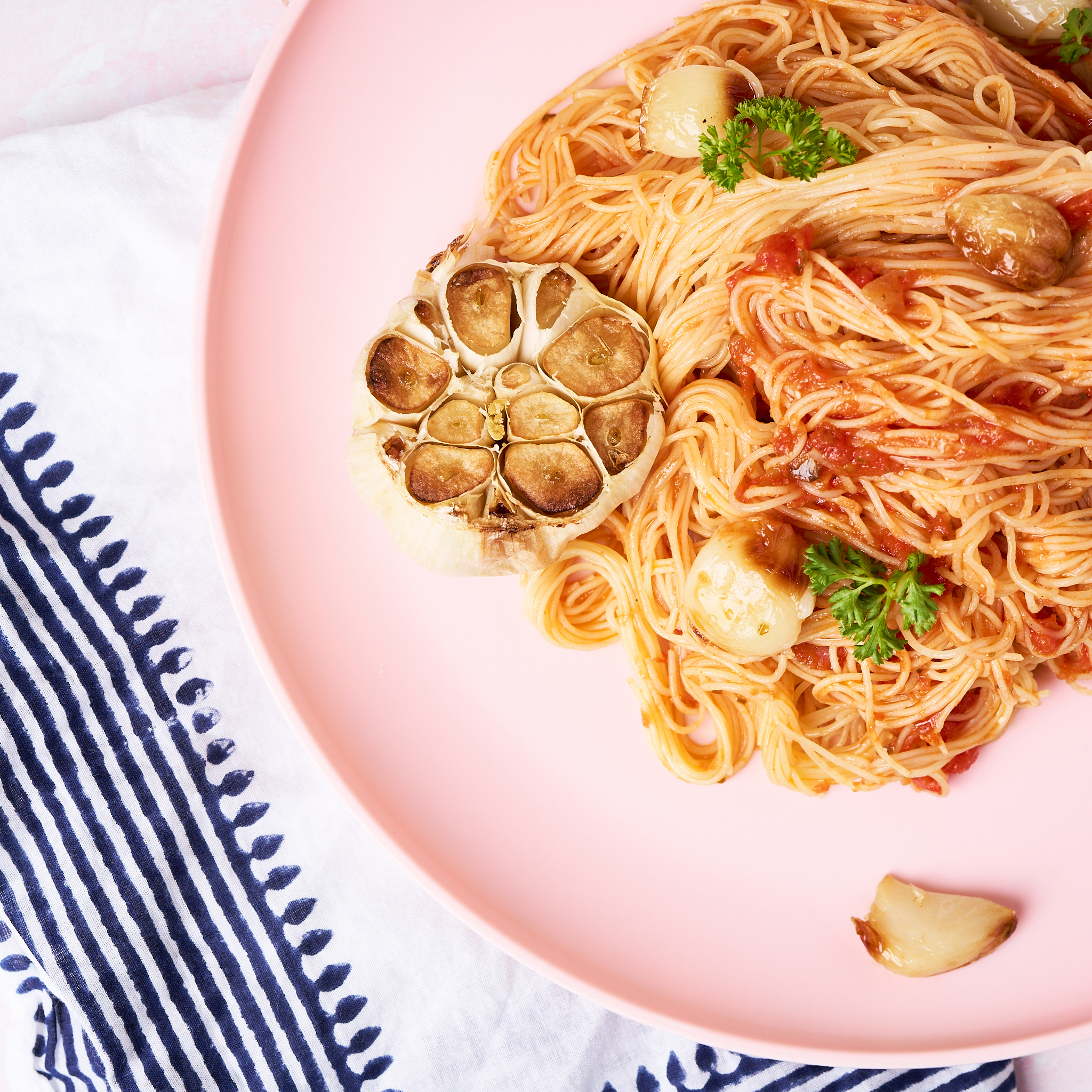 Roasted garlic angel hair pasta made with Sonoma Gourmet's roasted garlic sauce and proof 100 california extra virgin olive oil