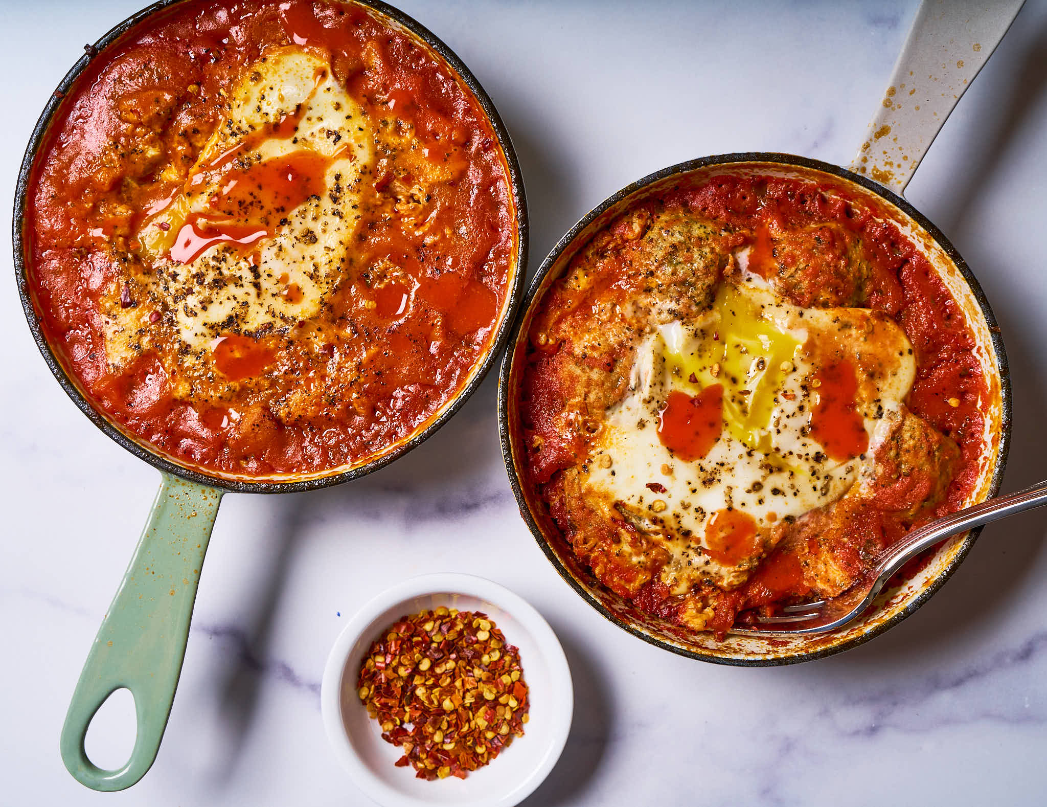 Mini shakshukas made with Sonoma Gourmet's cherry tomato basil sauce and proof 100 california extra virgin olive oil