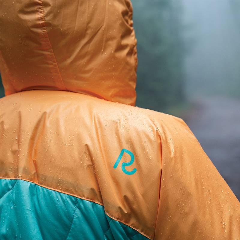 Close up on the Rumpl logo on the back shoulder portion of the Puffy Poncho
