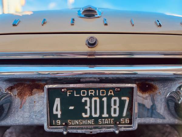 A vintage Florida license place on an old car bumper
