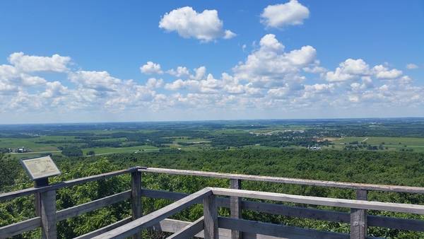 Ride your e-bike to an observation tower in Blue Mound State Park for incredible views of Wisconsin farmland and greenery. Image Source: Flickr