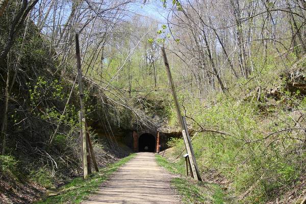 One of many historic tunnels on the Elroy-Sparta rail trail. Dismount and walk your e-bike through all tunnels on the trail! Image Source: Wikimedia Commons