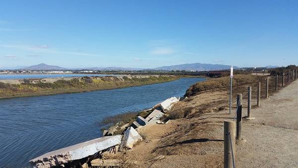 The Otay River flows gently next to the scenic and e-bike friendly Bayshore Bikeway in San Diego County