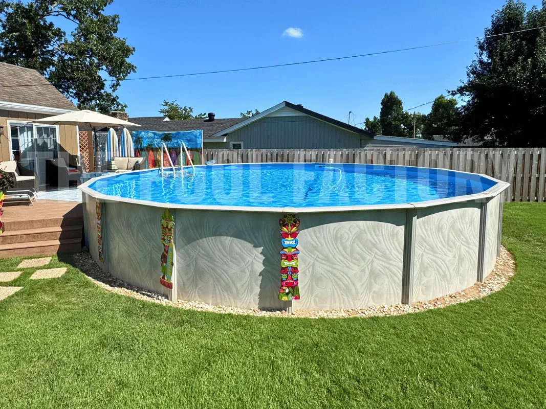 Large round above ground pool with partial deck, patio furniture, and green grass