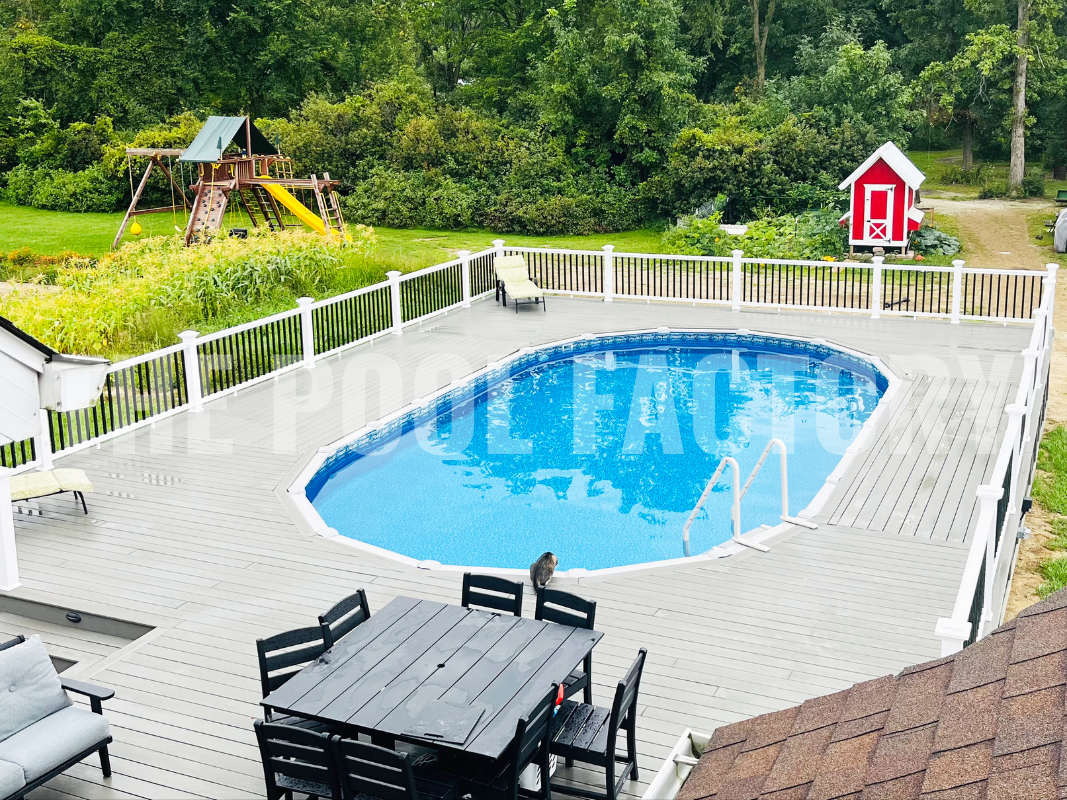 Above ground swimming pool with full deck and kid's play house nearby