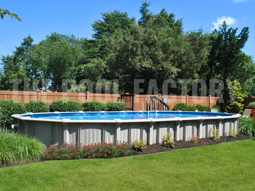 Backyard with oval swimming pool, sunny landscaping, and decorative plants