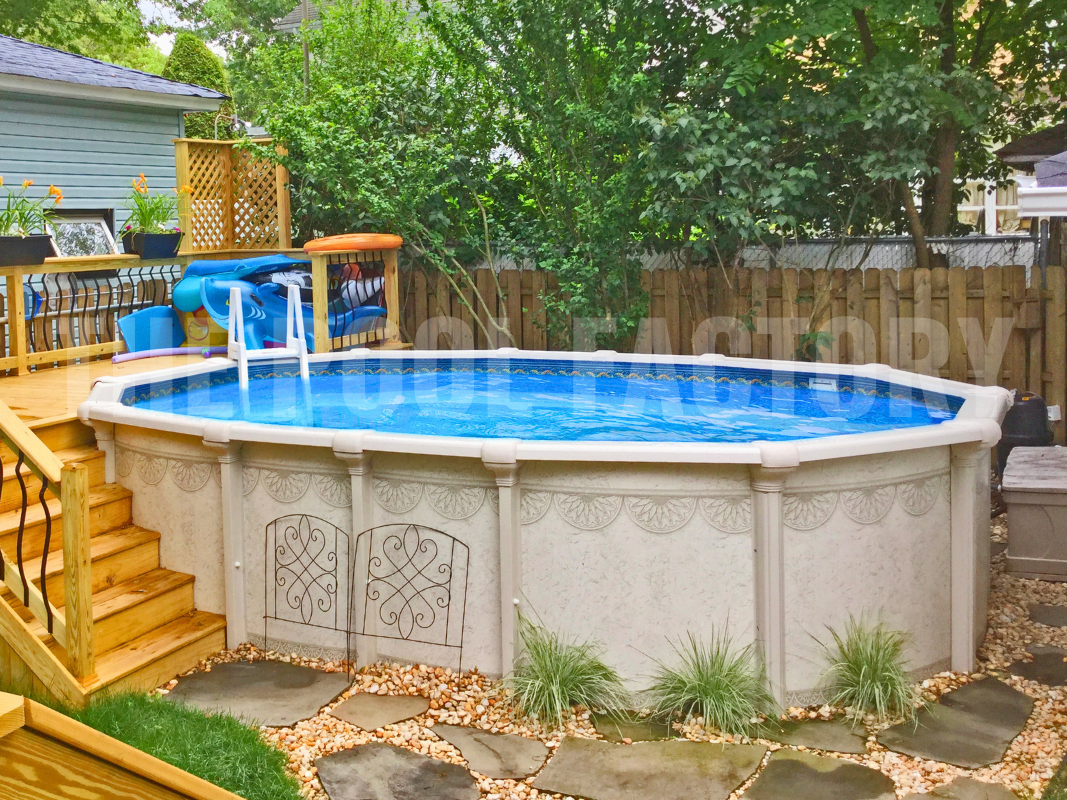 Oval above ground swimming pool with stepping stones and a partial deck