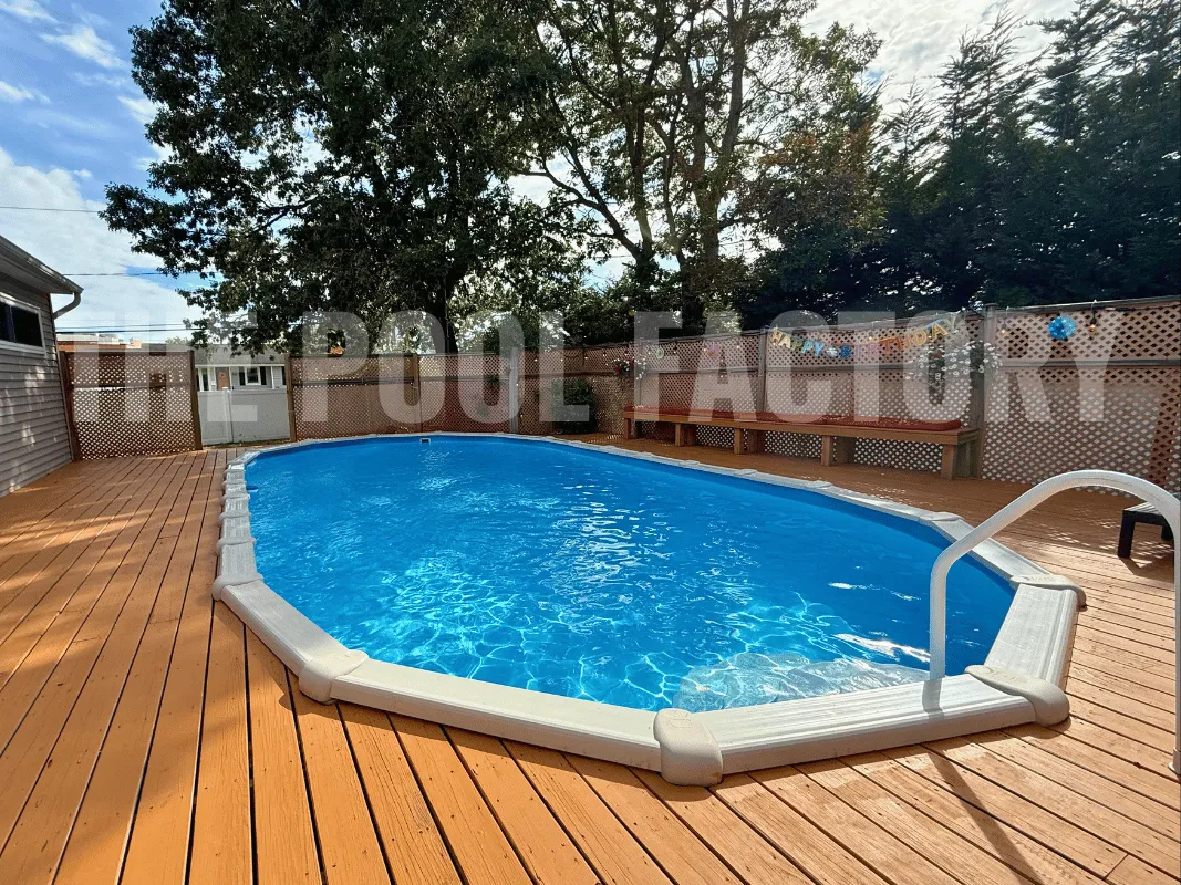 Oval above ground pool with full wraparound deck for spacious lounging