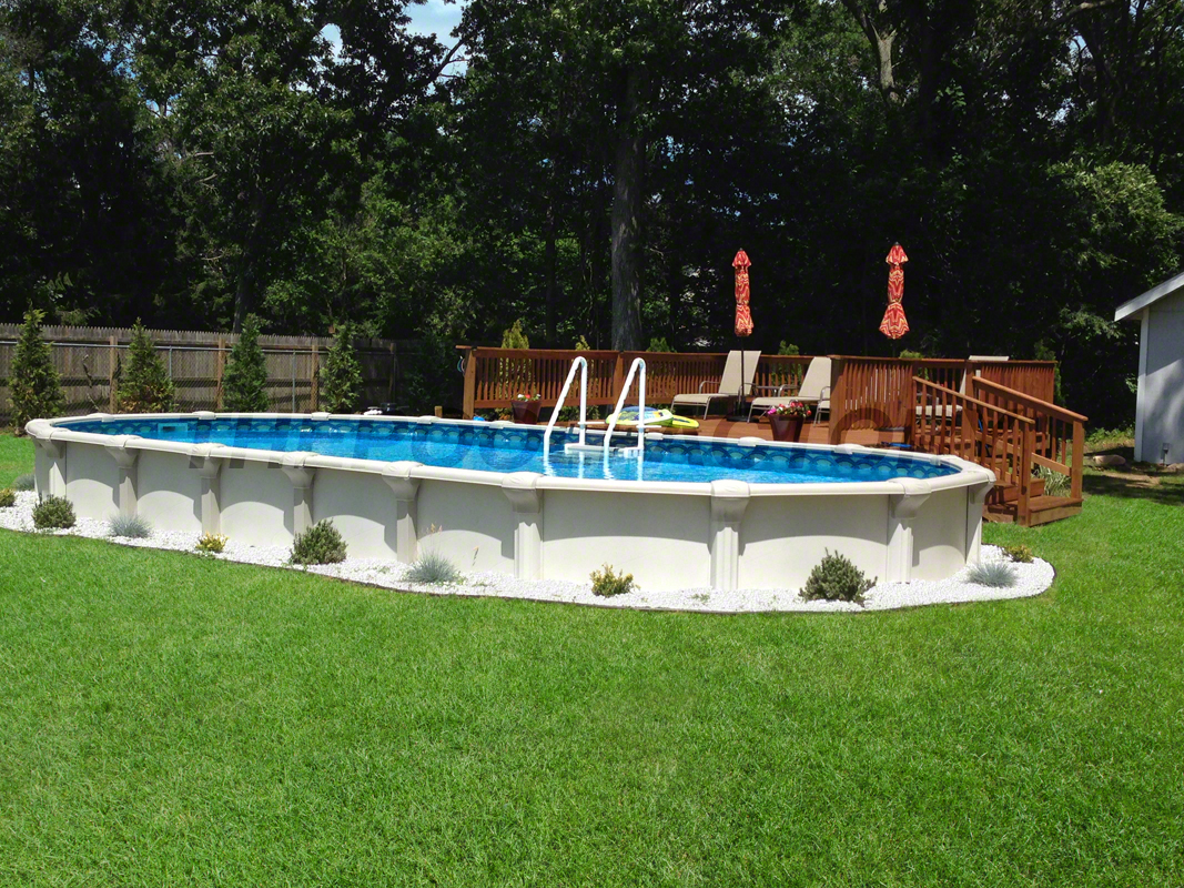 Semi-inground oval pool with lush backyard plants