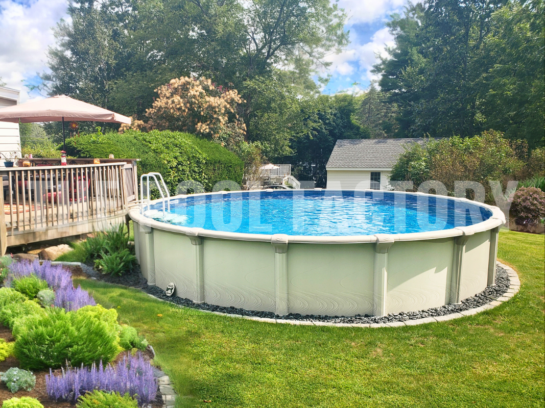 Round above-ground pool with a wooden deck and garden landscaping