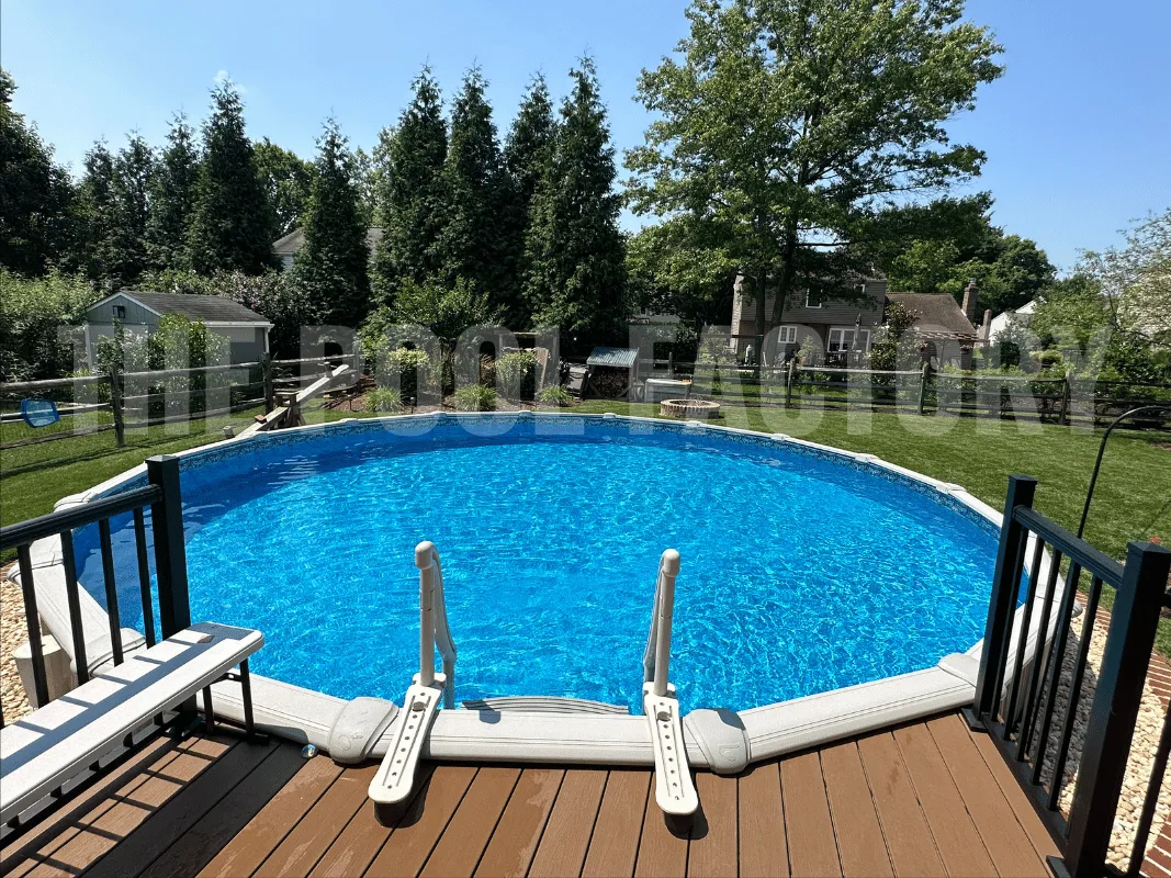 Backyard with round pool, wood deck extension, and relaxing outdoor area