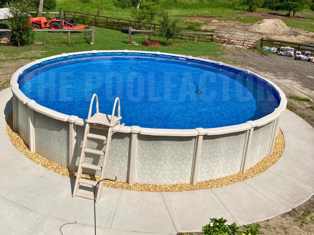 Above-ground round saltwater swimming pool with concrete patio, surrounded by greenery