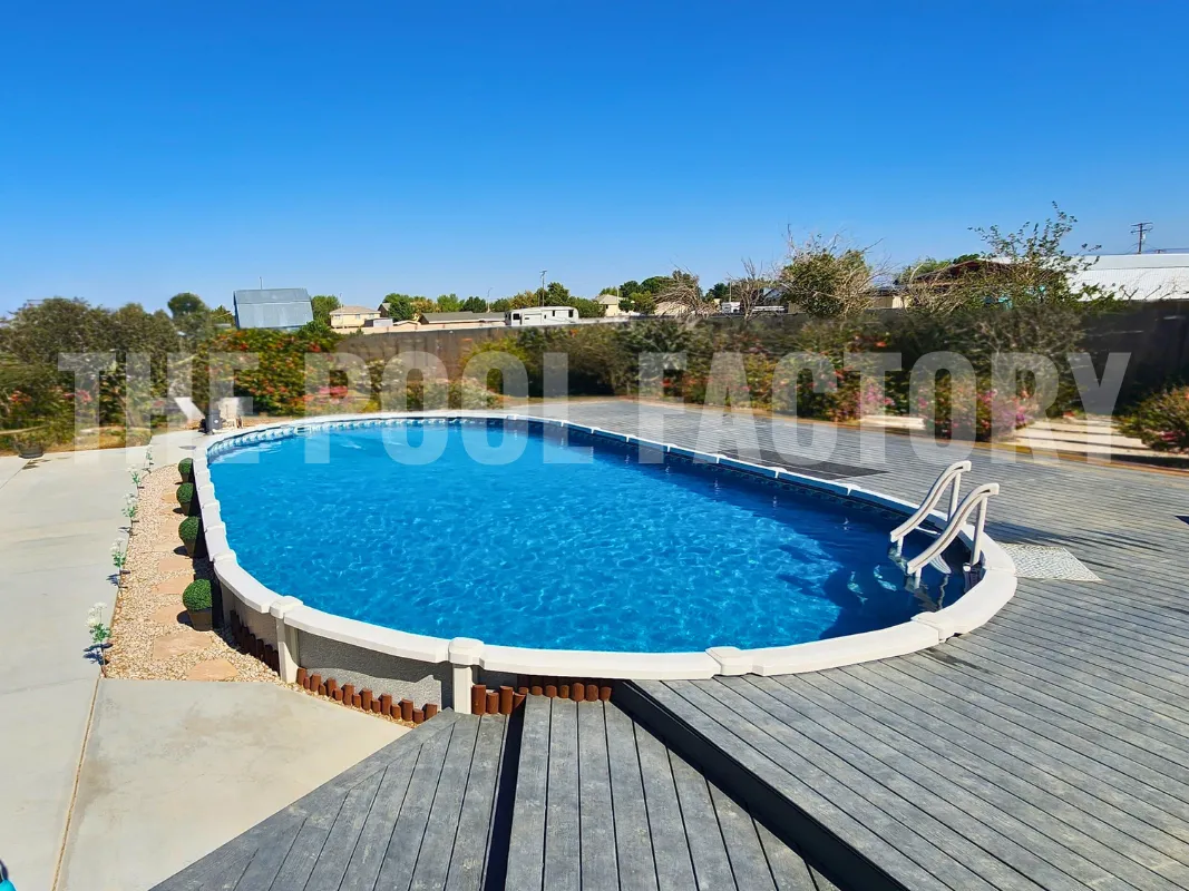 Modern backyard with oval saltwater pool and Trex deck for outdoor entertaining
