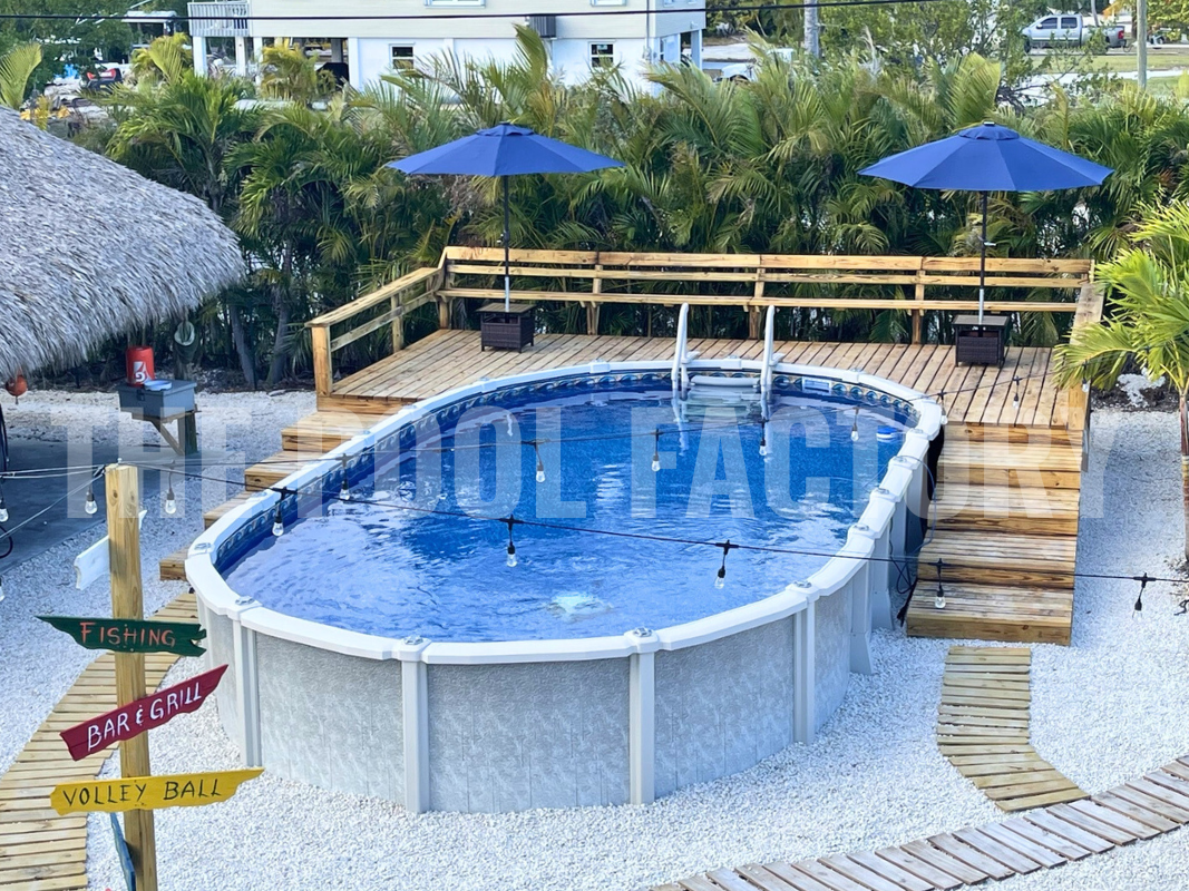 Above ground saltwater pool with partial deck, palm trees and decorative pathway